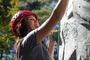 happy female climber bouldering